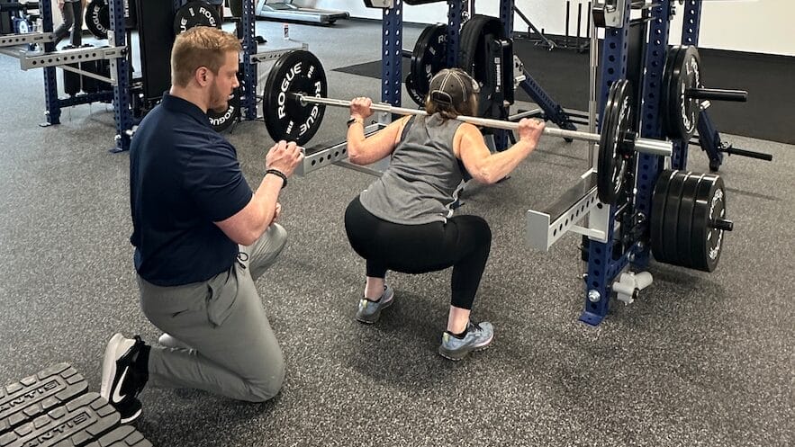 Woman doing barbell squats